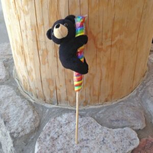 Black bear plush on lollipop stick.