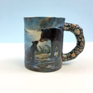 Bear scene on a mug with rock style handle.